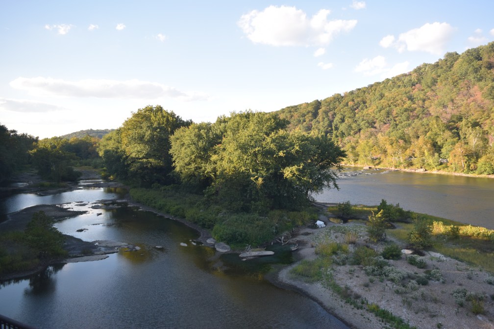 hill and river pass by